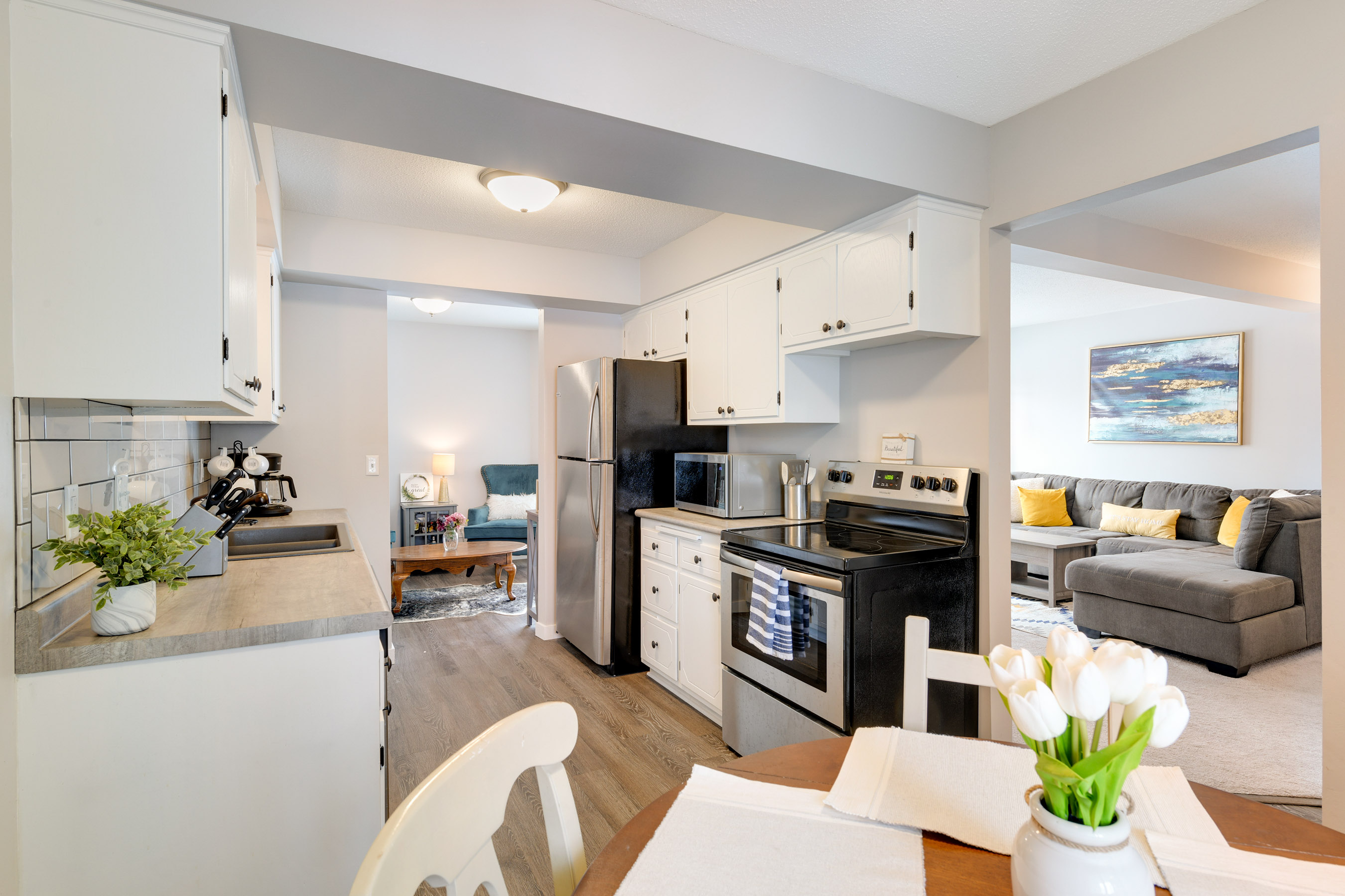 Kitchen opens to formal dining and living room