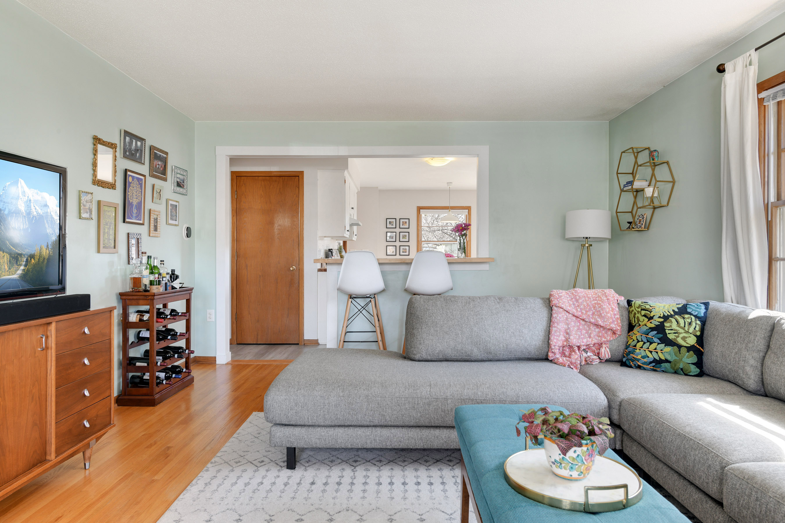 Living room opens to Kitchen
