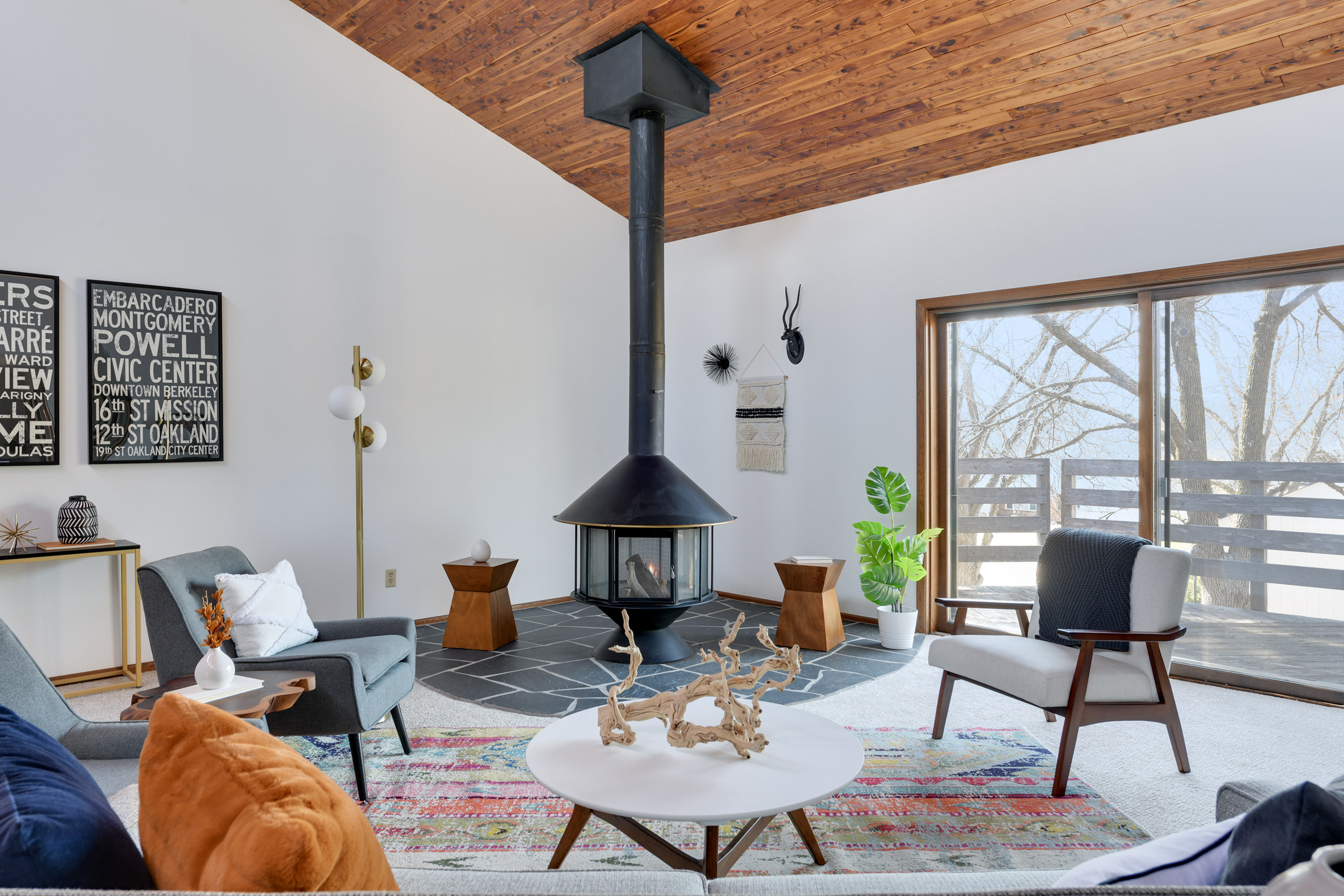 Living room with really cool freestanding fireplace