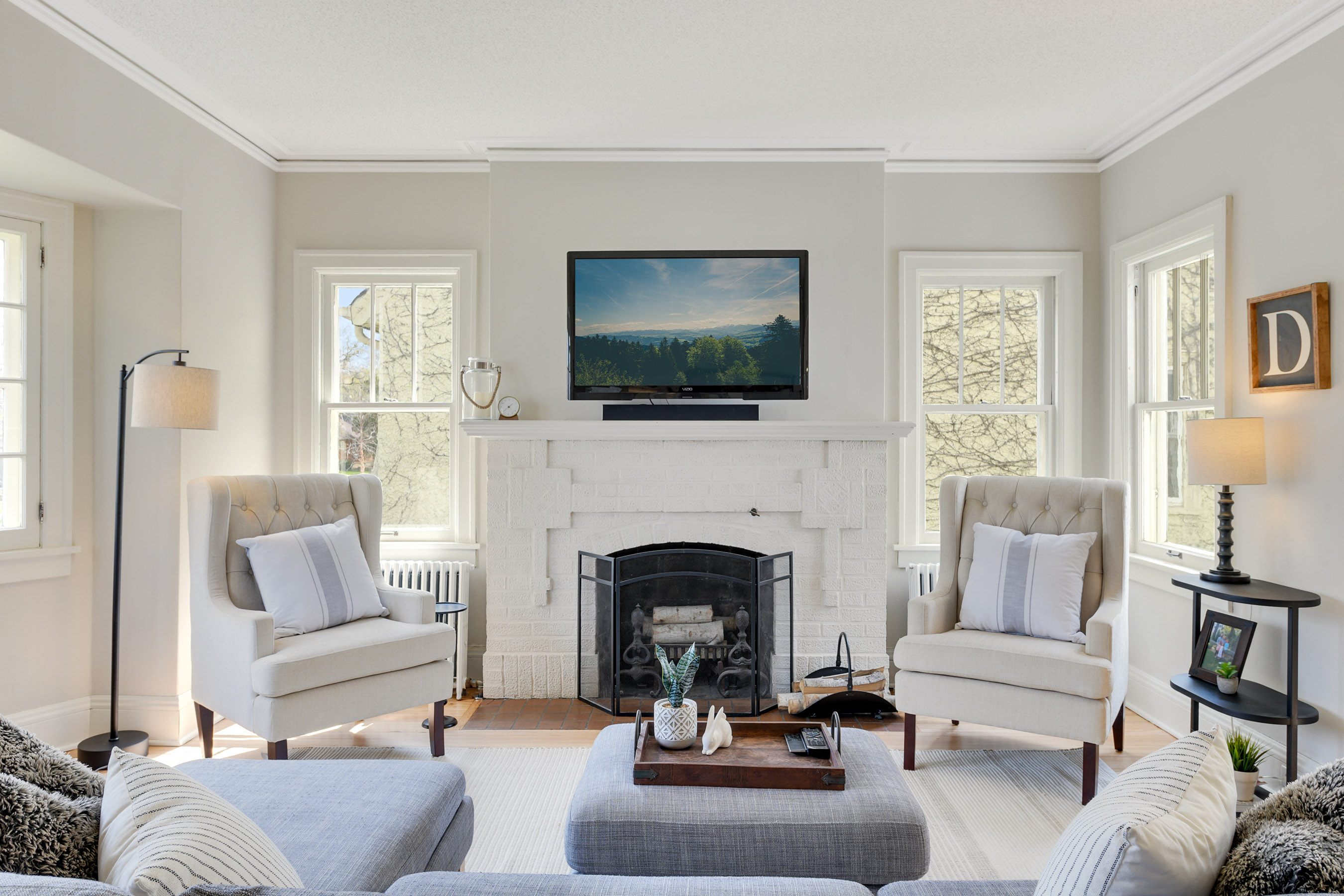 Wood burning fireplace encompassed by two South facing windows