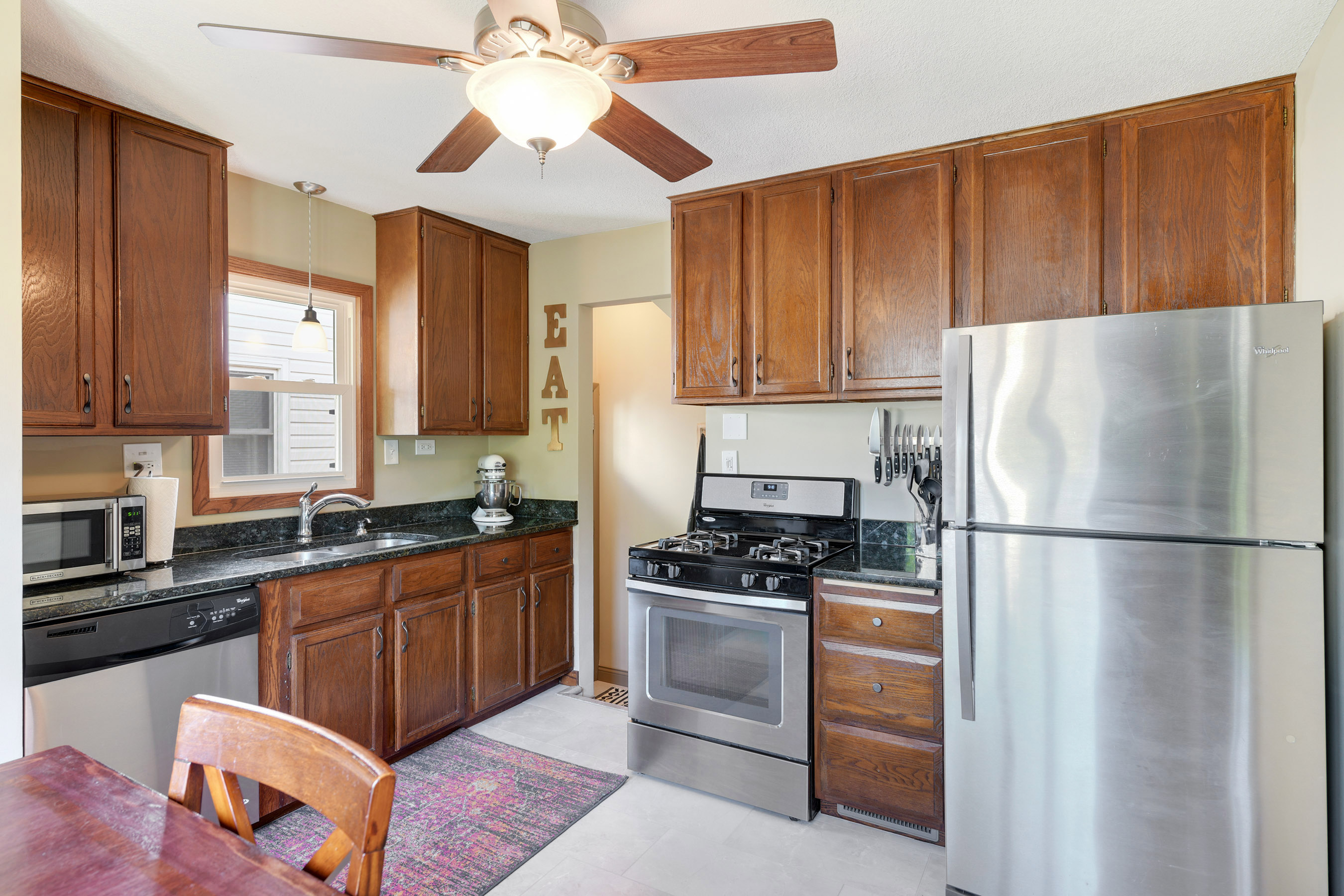 New Luxury Vinyl Plank Flooring complimenting stainless steel appliances!