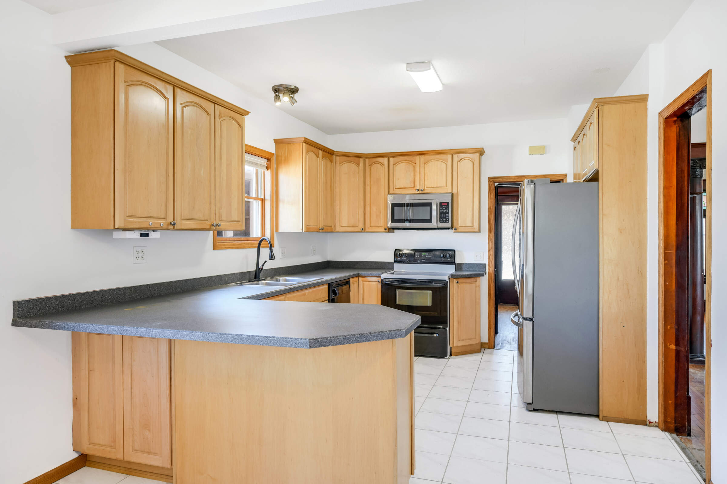 Lots of space to gather with countertop seating and a spacious eat-in area