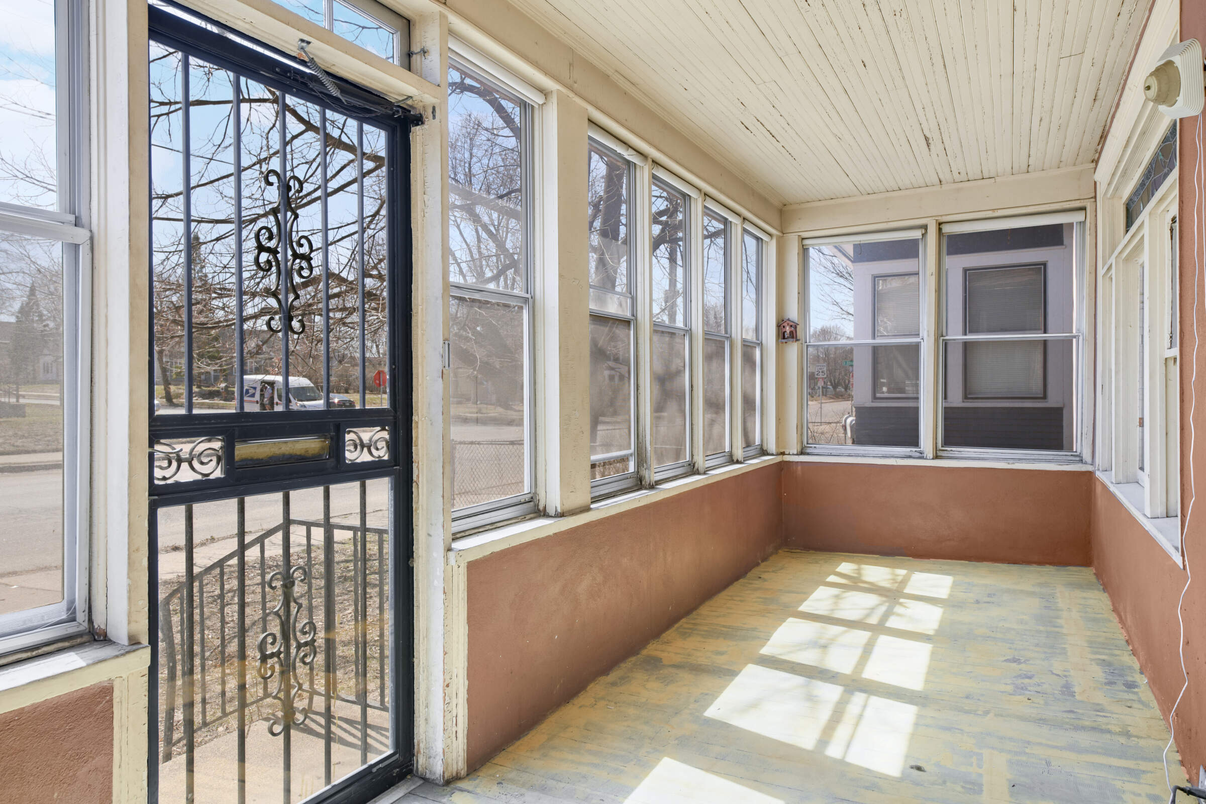 Inviting front porch with lots of windows and bright light