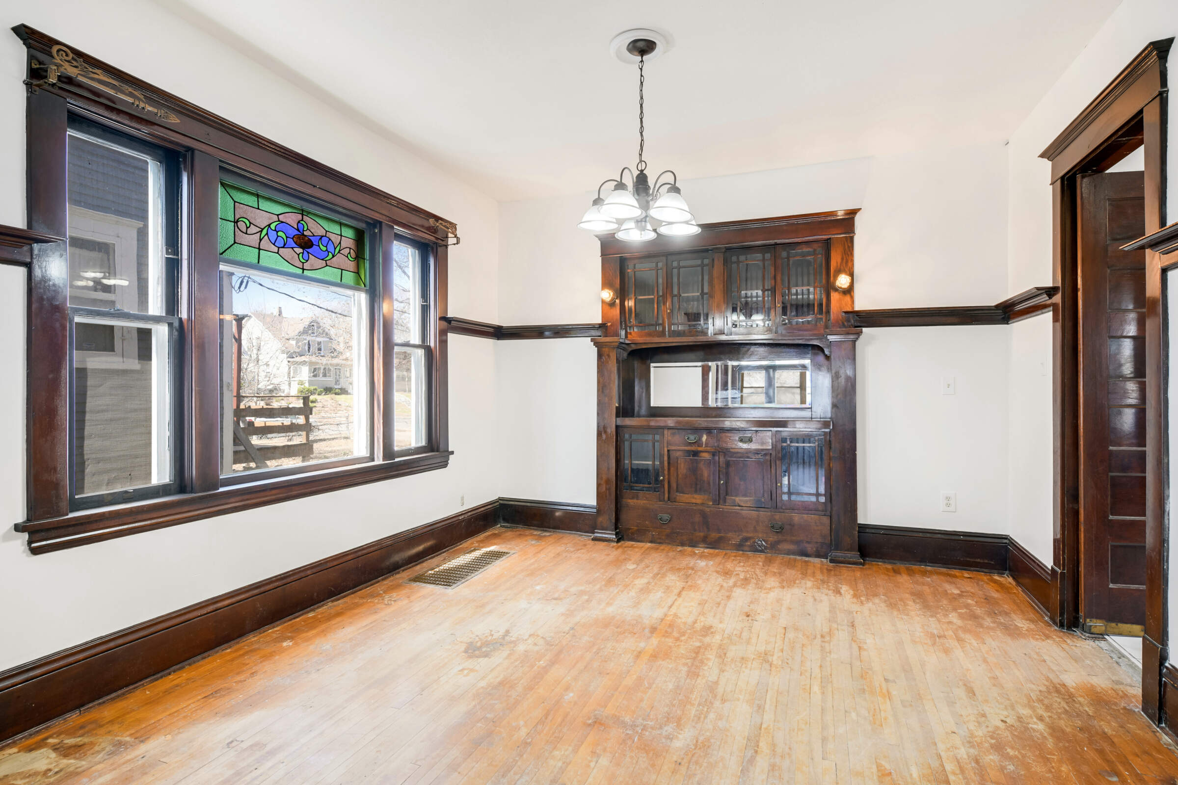 More beautiful stained glass, and a gorgeous built-in buffet add to the period detail