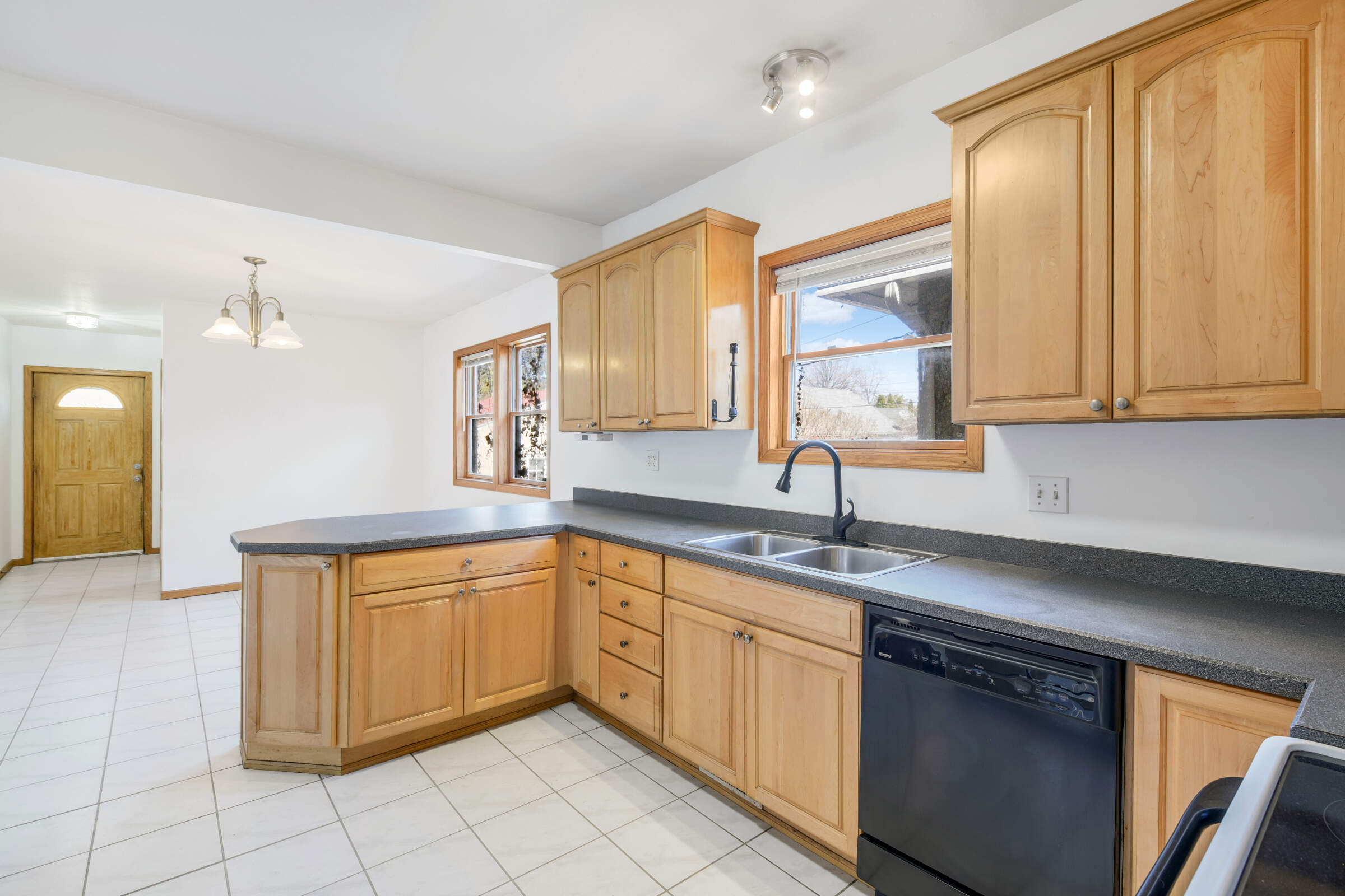 This spacious kitchen is a cook's dream with its abundance of storage and countertop space