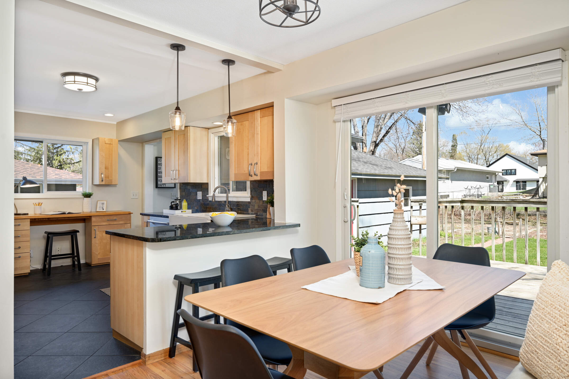 Dining area opens to kitchen and walkout through Andersen patio door to Deck