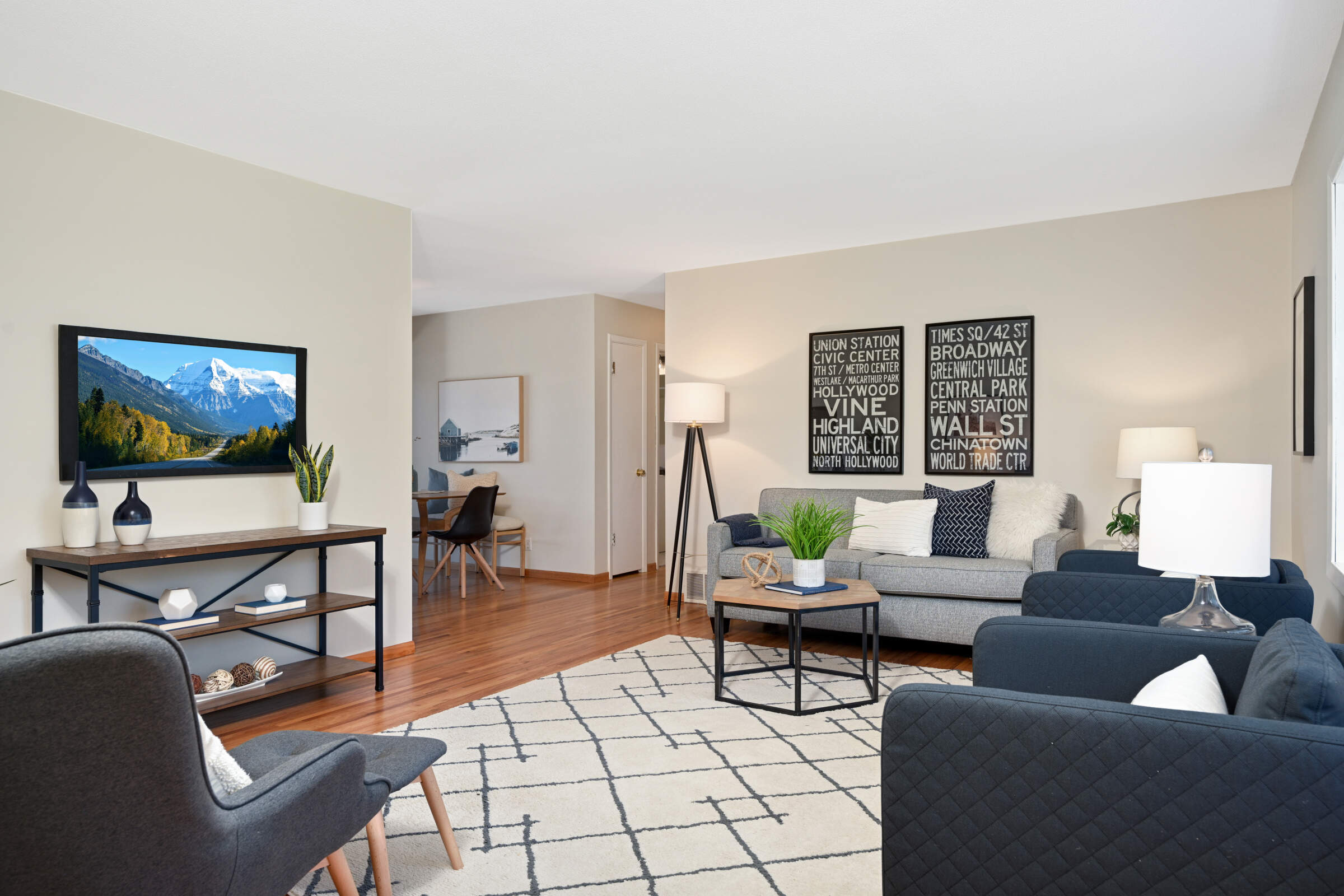 Living room with Hardwood flooring throughout main level (other than tiled kitchen and bathroom)