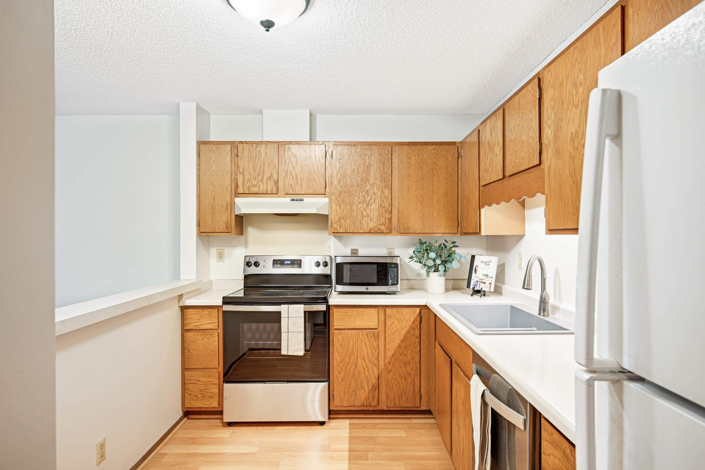Kitchen opens to Dining and Living room.